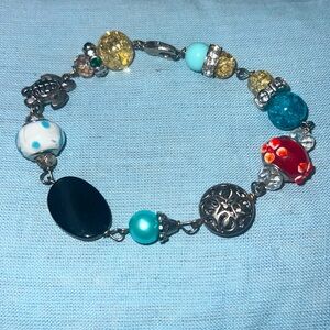 This is a beach themed bracelet with a clasp.